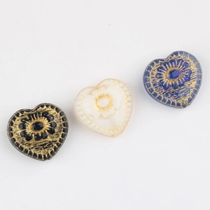 Vintage heart shaped Czech glass beads with gold floral embossing in black white and blue