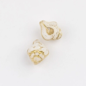 Detailed view of conch-shaped Czech glass beads with elegant gold foil accents
