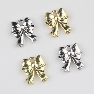 Colgantes de lazo dorados y plateados de aleación para creación de collares y pendientes DIY