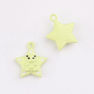 Detail of star-shaped panda pendant in light green with metal loop for DIY jewelry