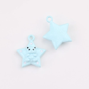Detail of light blue star charms with bear design and polka dots for DIY jewelry making
