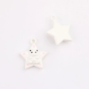 Detail of star-shaped pendant with a 3D panda motif and pink dots for DIY jewelry