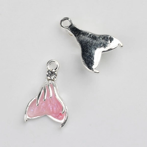 Detail of pink resin fishtail charms with rhinestones for DIY jewelry making