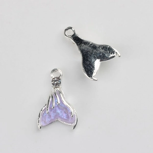 Detail of silver fish tail pendant with purple glitter enamel and sparkling rhinestone