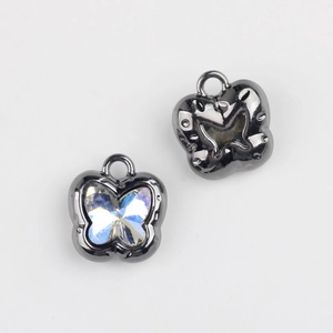 Macro shot of butterfly charms with brilliant zircon inlay and gunmetal finish for DIY jewelry