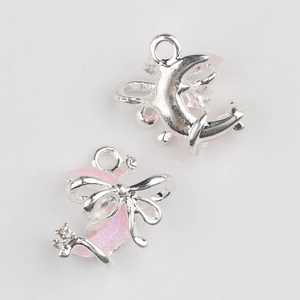 Detail of silver moon pendant with pink glitter resin and small rhinestones for DIY jewelry