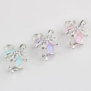 Three celestial moon and bow pendants with resin and zircon for DIY jewelry making