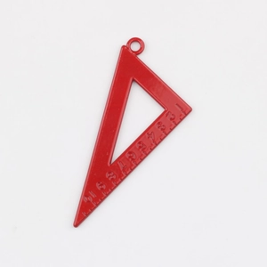 Macro shot of red painted triangle ruler charm with precise scale markings for DIY jewelry