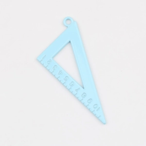 Detailed macro view of a light blue alloy triangle ruler pendant with clear scale markings