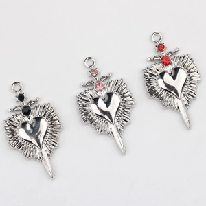 Three gothic heart sword pendants with black pink and red zircons in silver alloy