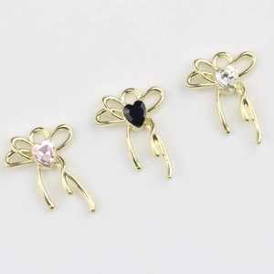 Golden alloy bow pendants with heart-shaped crystals for DIY jewelry making