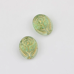Detail showing vintage green Czech glass beads with gold embossed rose patterns