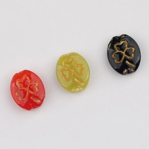 Czech glass beads set with gold clover pattern in red green and black for DIY jewelry