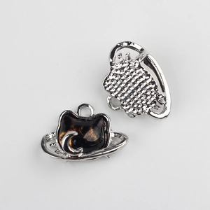 Macro view of cat head alloy pendants with resin inlay for DIY jewelry making