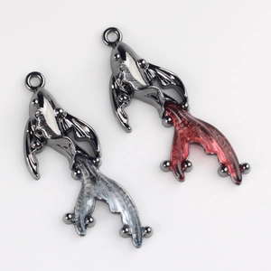 Detailed view of DIY goldfish charms with resin tails for necklaces and jewelry