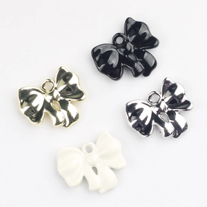 Colorful alloy bow pendants in black, white, gold and silver for DIY jewelry making