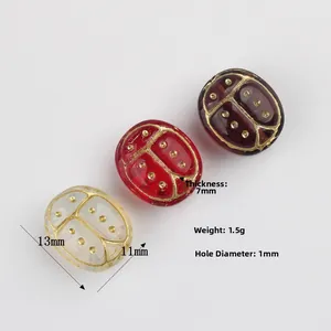 Hand-painted ladybug glass beads in red and white for DIY jewelry making 13x11mm