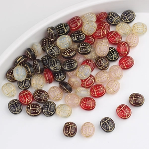 Hand-painted Czech glass beetle beads with gold patterns for DIY jewelry making