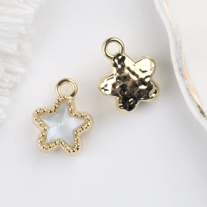 Detail of 11mm star pendant featuring hammered gold finish and zircon inlay for DIY jewelry