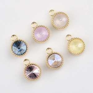 Set of six colorful alloy charms with faceted crystals and golden beaded edges