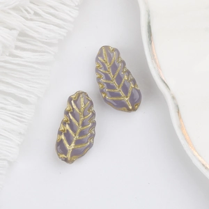 Detail of 15x7mm Czech glass leaf beads with gold veining for DIY jewelry making