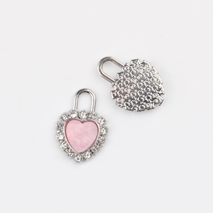Detailed front and back view of silver alloy heart lock pendant with pink inlay and crystals