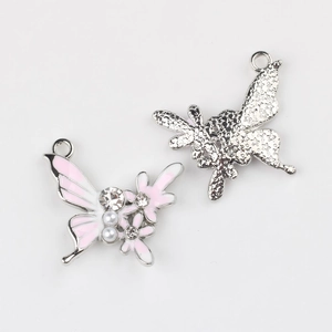 Front and back details of butterfly pendant with pink enamel and faux pearls