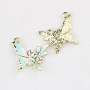 Detail of alloy butterfly pendant featuring light blue enamel and sparkling rhinestones
