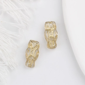 Detailed view of owl-shaped glass beads with gold foil for DIY handmade jewelry crafts