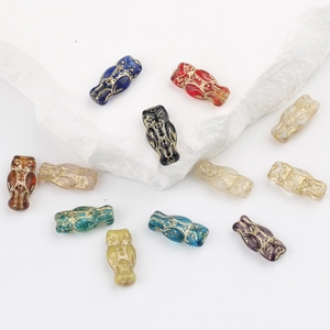 Vintage owl-shaped glass beads with gold-rimmed relief for DIY jewelry making