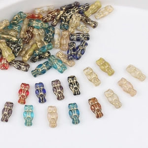 Handmade Czech glass owl beads with gold detailing for DIY jewelry making in multiple colors