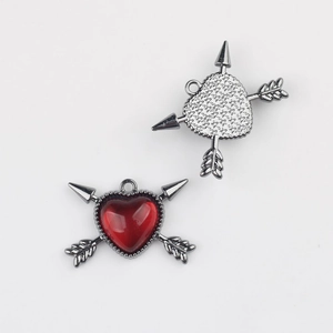 Detailed view of alloy heart arrow pendants with red resin and gunmetal finish for DIY