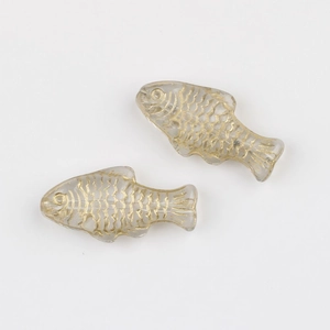 Detail of translucent glass fish beads with hand-painted gold scales for DIY jewelry