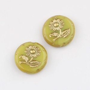 Detailed view of hand-painted gold sunflower Czech glass beads for jewelry making