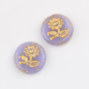 Macro detail of lavender Czech glass sunflower beads with vintage gold hand-painted accents