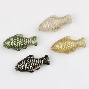 Detail of Czech glass fish beads with gold hand-painted scales for DIY jewelry