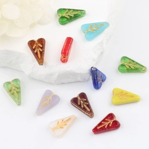 Handcrafted Czech glass heart beads with gold-painted leaf patterns for DIY jewelry