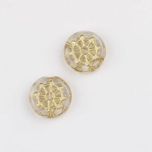 Close-up of Czech glass beads with gold spider web pattern for DIY jewelry making