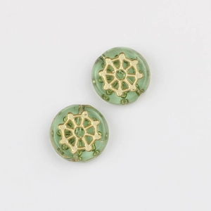 Detail of green Czech glass beads with hand-painted gold spider web pattern for DIY crafts