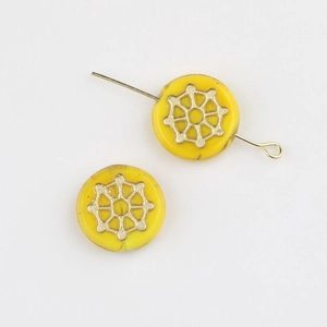 Macro view of Czech glass beads with gold spider web pattern for DIY jewelry making