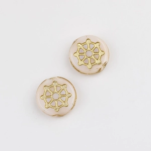 Detailed macro view of Czech glass beads with gold spider web pattern for DIY jewelry