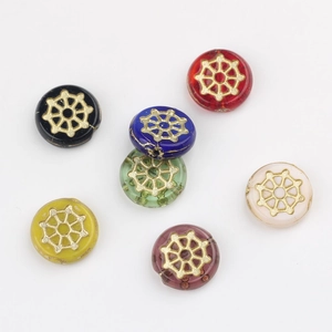 Macro shot of 12mm spiderweb glass beads with gold accents in various vibrant colors