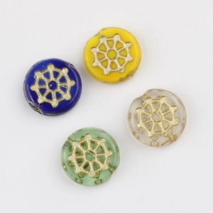 Macro shot of 12mm spiderweb glass beads with gold accents in mixed colors