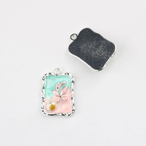 Front and back detail of Monet Garden style butterfly charms for DIY jewelry making