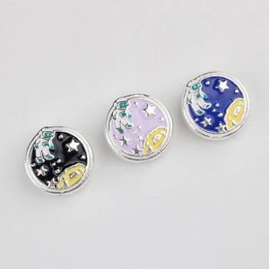 Detailed view of astronaut and planet enamel beads for DIY jewelry making