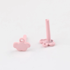 Detail showing pink cloud-shaped resin earring studs with a fresh summer matte finish