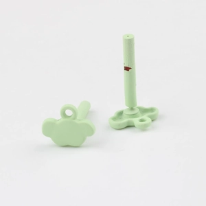 Detail of light green matte cloud earring charms with stainless steel pins for DIY jewelry