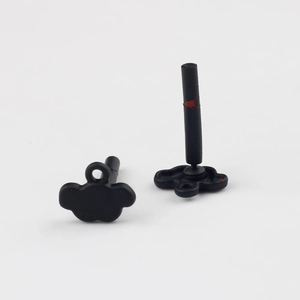Macro view showing the front and back of matte black cloud-shaped DIY earring components