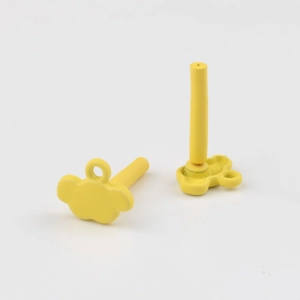 Macro view of yellow cloud-shaped DIY earring components with stainless steel pins