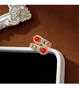 Detail of snake-style open ring with red agate beads and sparkling zircon stones